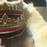 Some props get used for every show. Here, we are adding fur to the crown's edge to change it's look. Photo credit: Liegh Toland